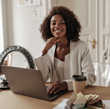 African-american-woman-on-her-laptop-on-her-interior-design-studio.