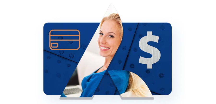 Woman sitting on a sofa with laptop smiling.