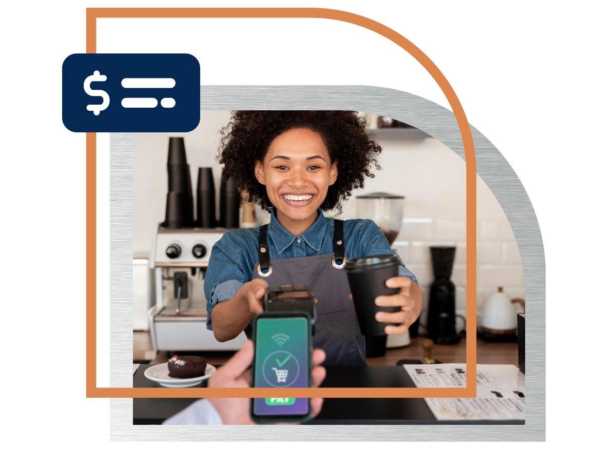 Business owner holding out a payment scanner at her coffee shop with a coffee in her hand Business owner holding out a payment scanner at her coffee shop with a coffee in her hand