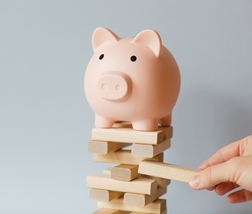 Piggy Bank on a Jenga Set