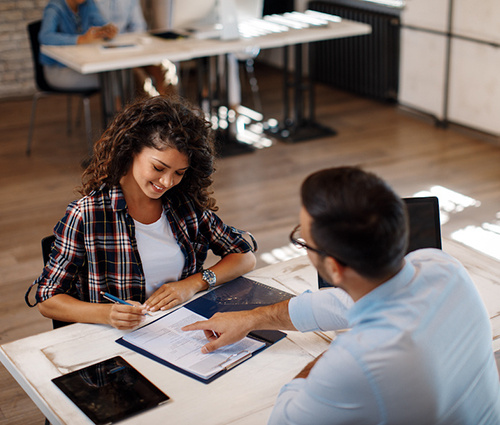 Woman Signing Paperwork