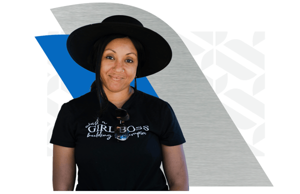 Smiling entrepreneurial woman wearing a black Girl Boss shirt